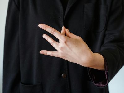 Close up of hands in a meditation mudra position.