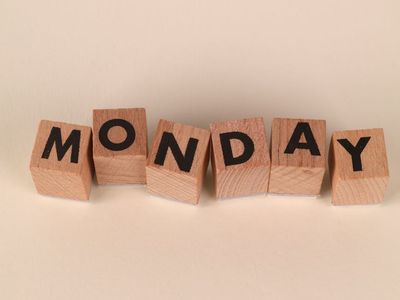 Eco-friendly yoga block and strap on a neutral background.